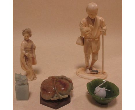 Four jade carvings; a peach, a dragon topped seal, a bowl and another and a Japanese ivory man with a staff and another of a 