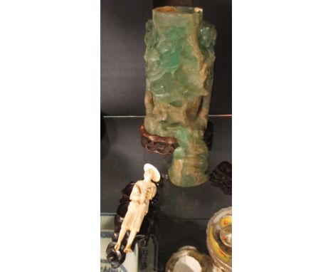 A Chinese fluorite vase and cover as a lamp and a Chinese ivory fisherman together with an additional hardwood stand (3) 