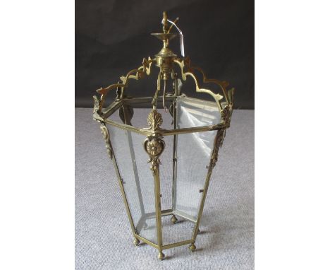 A brass hanging lantern in the antique style 
