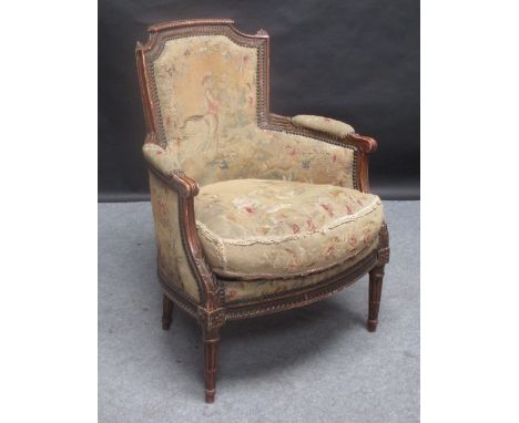 A pair of tapestry upholstered tub armchairs 