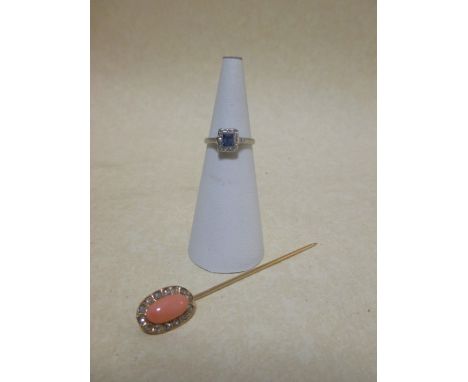 A coral stick pin and small dress ring (2) 