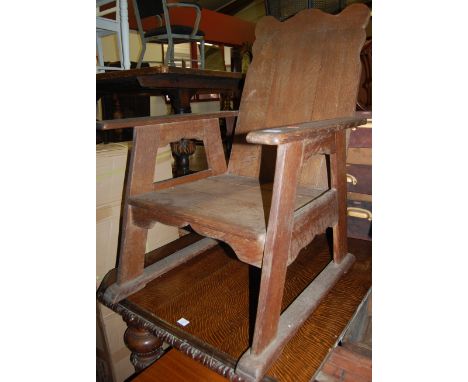 A circa 1900 Arts & Crafts oak panel seat open armchair Condition Report / Extra Information Stands well.
Arms slightly wobbl