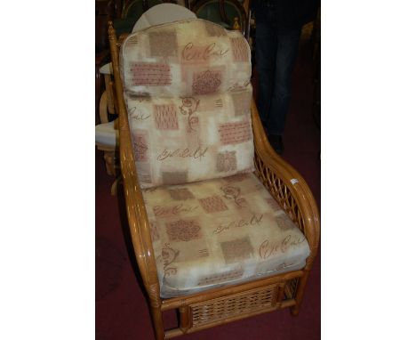 A modern bamboo effect three piece conservatory suite comprising; twin sofa and pair of armchairs, with cushion upholstery 