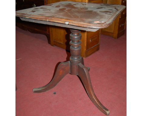 A Victorian mahogany round cornered tilt-top pedestal tripod table 