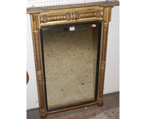 A Regency giltwood pier mirror, having inverted breakfront top and cushion moulded surround 
