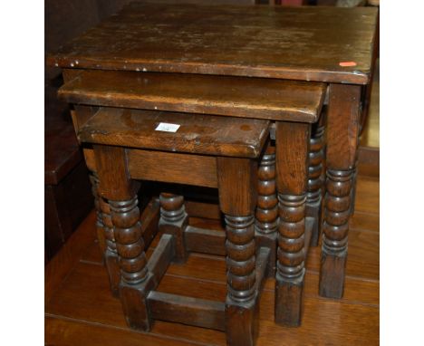 A joined oak bobbin turned nest of three occasional tables 