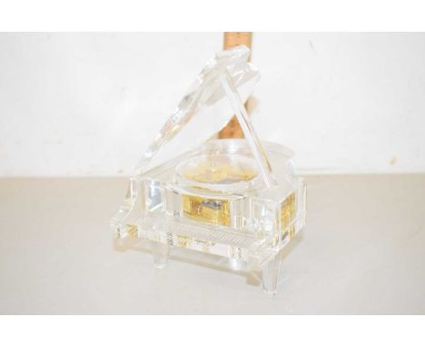 A modern glass musical piano model