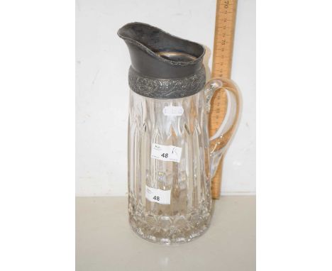 A cut glass jug