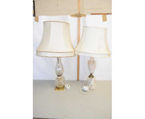 Two table lamps one with a cut glass base the other with a polished onyx base