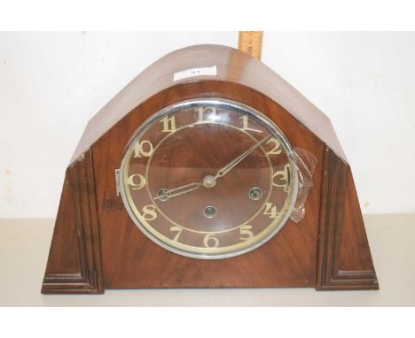 An early 20th Century walnut cased mantel clock in the Art Deco style