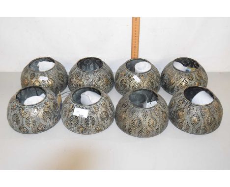 Set of eight honey and wild tea light holders