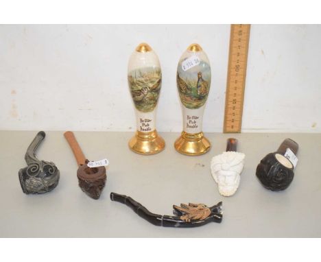 A collection of vintage tobacco pipes and two ceramic novelty decanters formed as bar taps