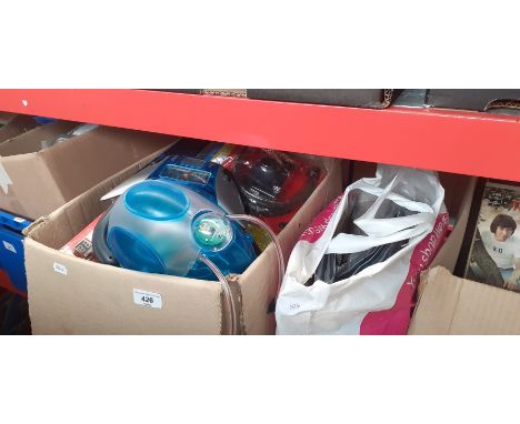 A box and a bag of 'Real Robot' magazines and robot parts. 