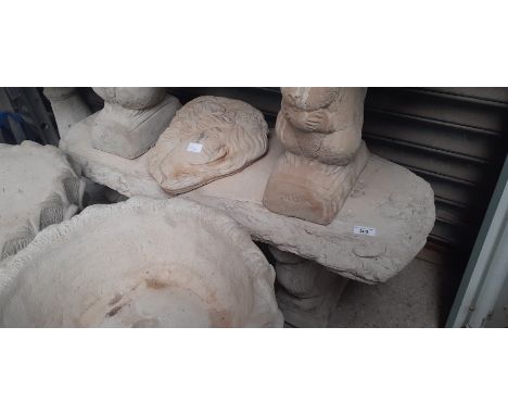 A log effect concrete bench on squirrel plinths 