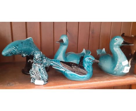 Five blue glazed Poole Pottery animals; two ducks, a seagull, a trout and a harvest mouse. 