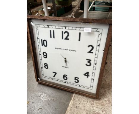 A large clock by English Clock Systems, London. 