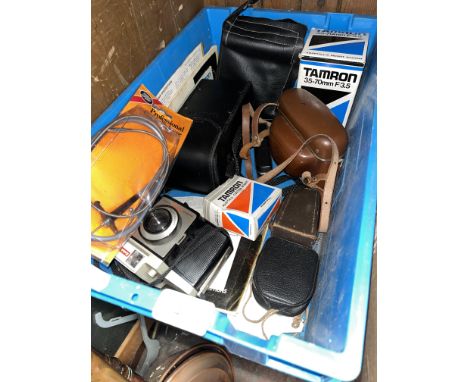 A box of camera equipment including Tamron lense, 2 cameras, etc. 