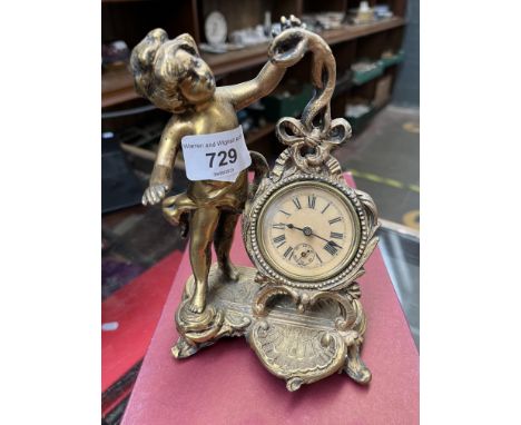 Brass mounted wind up clock, Rococo style with cherub, possibly New Haven 