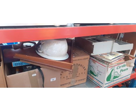 Three boxes of assorted items including books, a breakfast tray, tools, brass blowlamp, a part tea set, a 3 way mirror, games