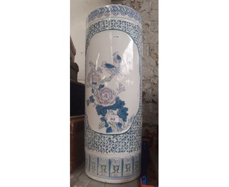 A Chinese ceramic stick stand, decorated with birds and flowers. 