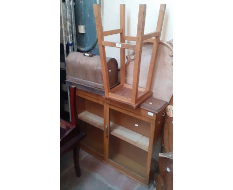 A mixed lot comprising glazed oak bookcase, vintage lab stool, wall shelf and a Jones hand crank sewing machine.