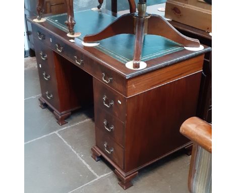 A mahogany pedestal desk with tooled leather writing surface, standing on ogee bracket feet, height 76cm, width 122cm and dep