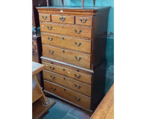 A 19th century mahogany chest on chest with brushing slide, standing on bracket feet, height 176cm, width 108cm and depth 53.