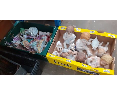 Various ceramic piano dolls and figurines. 