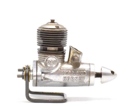 Two American 049 aero model aircraft engines:Holland 'Hornet 049', 0.8cc glow, USACox 'Thermal Hopper 049', 0.8cc glow, USA