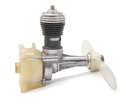 Two Cox aero model aircraft engines:Cox 'Space Bug Jr', 0.8cc glow, USA, boxedCox 'Space Hopper', 0.8cc glow , USAQty: 2