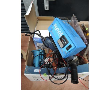 A selection of garage tools including angle grinder and car jack