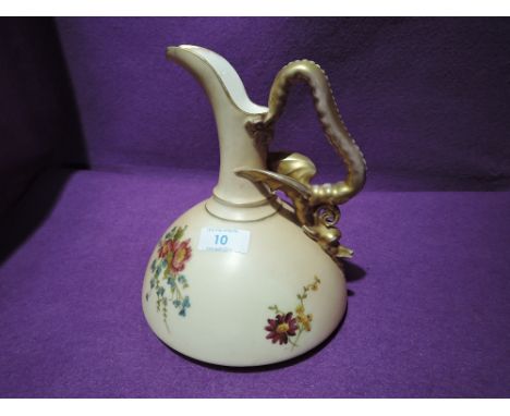 A ceramic jug in the blush ivory Royal Worcester style