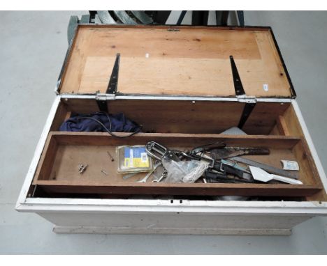 A vintage pine tool chest with contents and tools