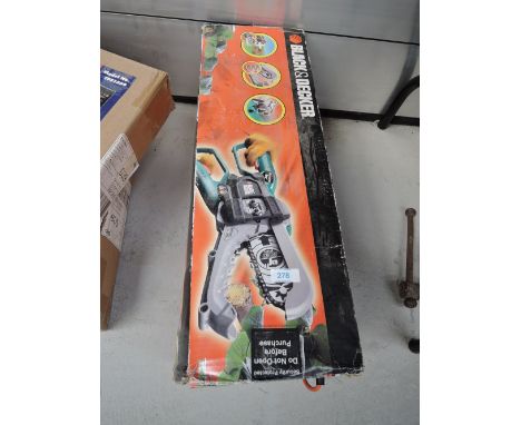 A black and decker two handed electric chainsaw