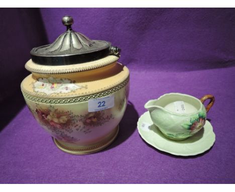 A Carltonware biscuit barrel  Rd No 488460 and a Carlton ware jug and saucer