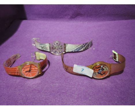 Two Swatch watches and a Sydney 2000 watch