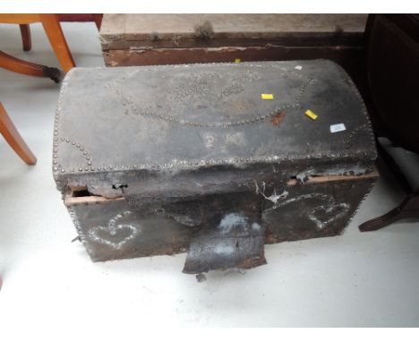 A traditional dome top cabin trunk having studded leather decoration