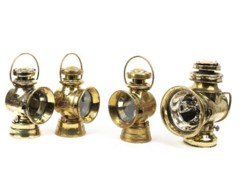 Four brass motoring lamps,comprising 'Edges Motor Lamp', Lucas pattern oil illuminated, with 4 inch diameter lens; and The 'B