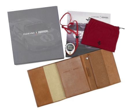 A Fiorano Ferrari Corse 2006 Season driver's racing presentation pack,comprising brown leather-bound driver training book for