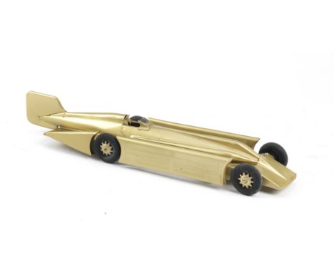 A 'Golden Arrow' clockwork toy by Kingsbury, 1929,painted gold (paintwork re-conditioned) with original rubber Dunlop tyres, 
