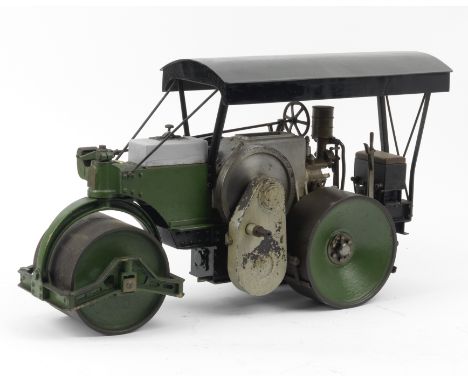 A live steam engineer's scale model of an Aveling Porter type  Road Roller,painted in green with a black canopy, 58cm long.  