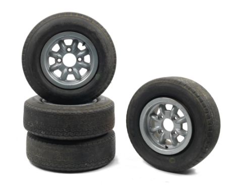 A set of four 6 inch Minilite wheels,finished silver/blue, fitted with Dunlop Racing CR65 tyres 5.00L-10, used, inspection ad