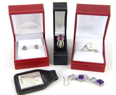 Various jewellery 925 etc., a crossover ring set with faux pearl, size R, a dress ring claw set with purple stone, silver key