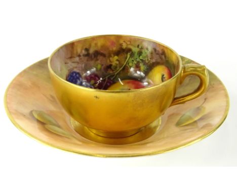 A Royal Worcester cabinet cup and saucer, by Edward Townsend, hand painted with brambles and apples, 1924, the saucer 11cm di