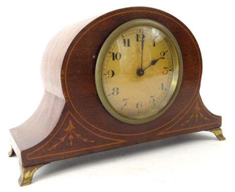 An Edwardian mahogany and boxwood strung mantel clock, the shaped case on metal stylised bracket feet, revealing an 8cm Arabi