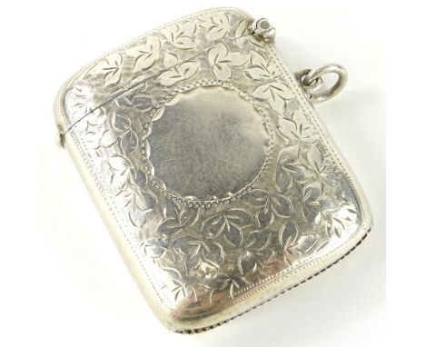 An Edwardian silver Vesta case, of shaped form with vacant cartouche, partially engine turned with silver gilt interior, Birm