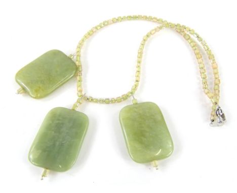 A necklace, set with three large sections in polished jade colour, with a sectional necklace, each section 4cm high. 