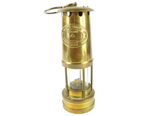 A 20thC Thomas and Williams Cambrian miner's lamp, No. 108760, of cylindrical form with glass centre, 'S' shaped hook top and