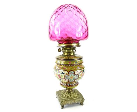 A very early 20thC oil lamp, with brass mount marked Everd No 3 Duplex London, the inverted shouldered pottery body, decorate