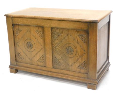 An oak blanket box, of rectangular form with double panel front on square stiles, 61cm high, 96cm wide, 47cm deep.